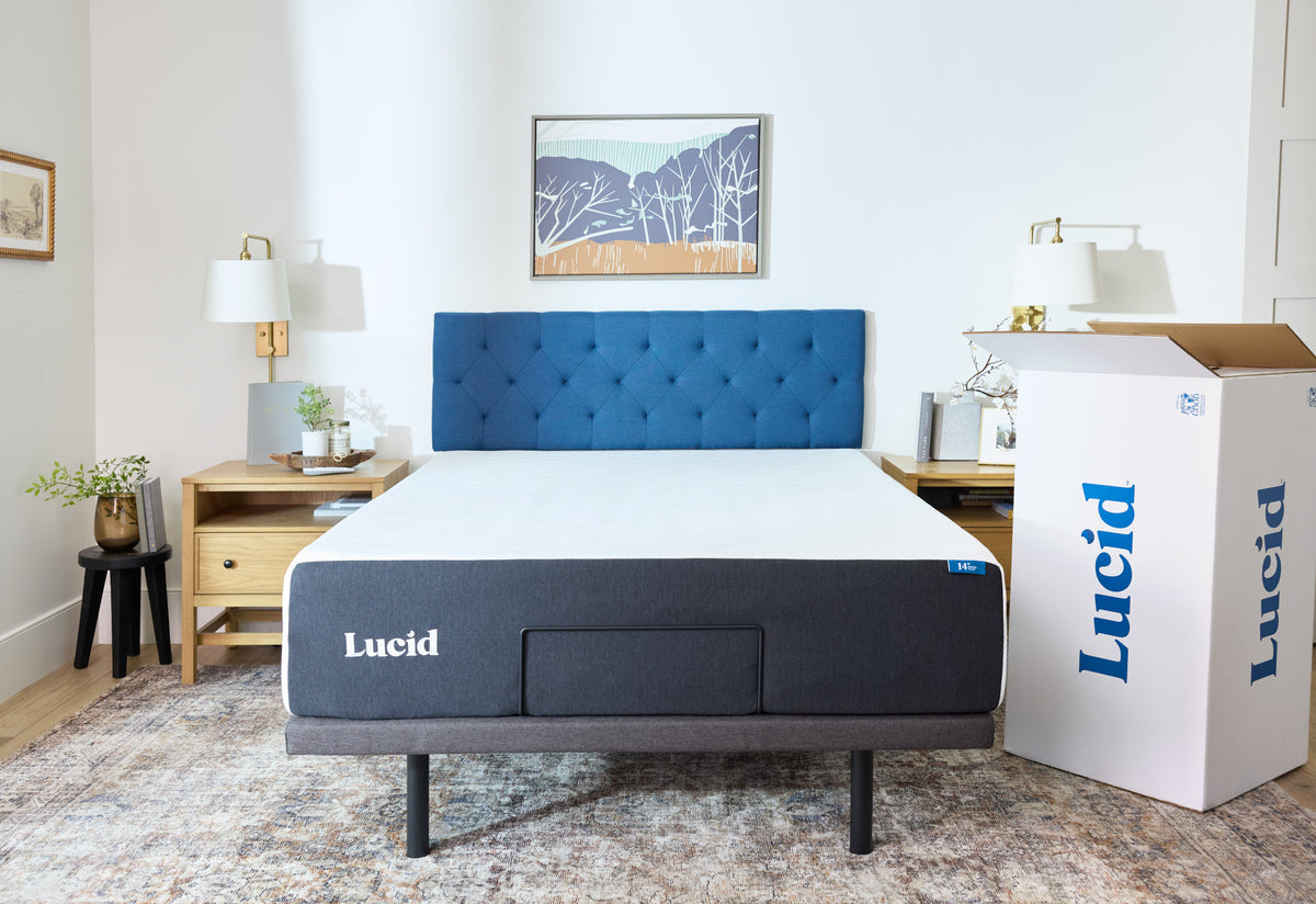 Lucid mattress with a blue upholstered headboard in a bright, modern bedroom, featuring wooden nightstands and a Lucid mattress box.